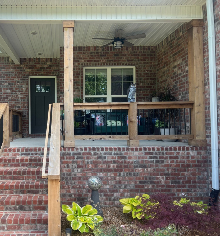 Brick front porch with refinished natural cedar posts and railings