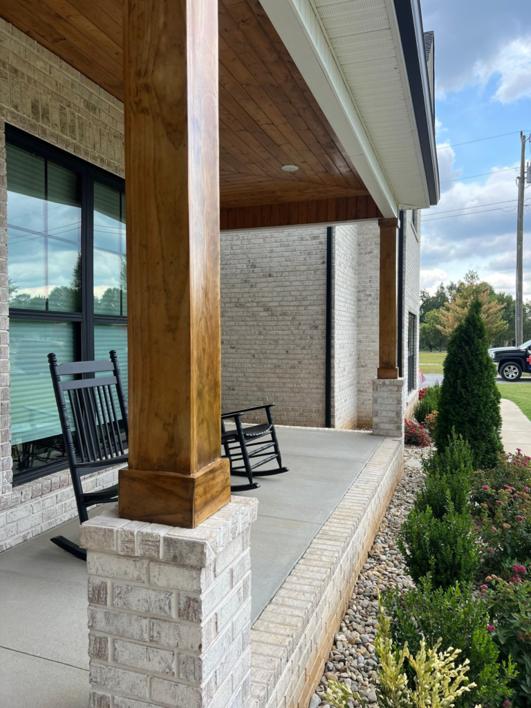 Covered porch with stained cedar posts and tongue-and-groove ceiling