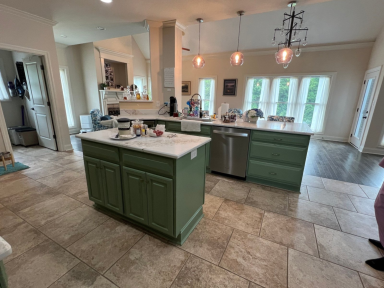 Kitchen with cabinets refinished in sage green