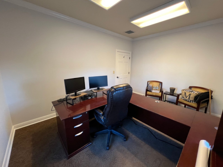 Freshly repainted private office with crown molding and furniture back in place
